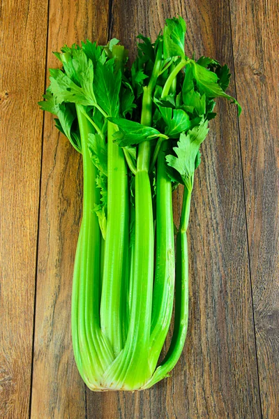 Fresh Juicy Celery on Woody Background — Stock Photo, Image