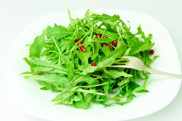 Sallad på rucola och granatäpple. — Stockfoto