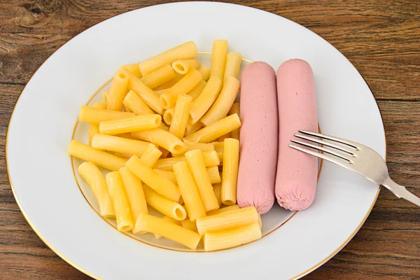 Eating Fast Food: Pasta with Sausage on Plate — Stock Photo, Image