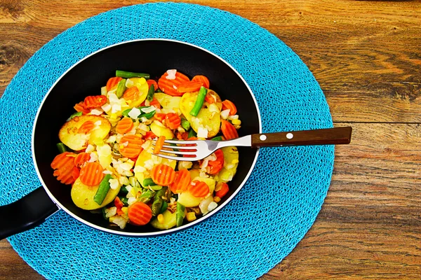 Steamed vegetables potatoes, carrots, corn, green beans, onion