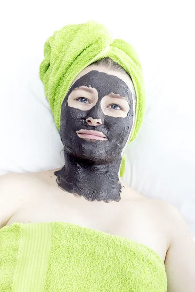 Girl with cosmetic mask — Stock Photo, Image