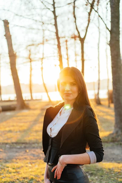 Beautiful business lady in a sunny park. Portrait Stock Image