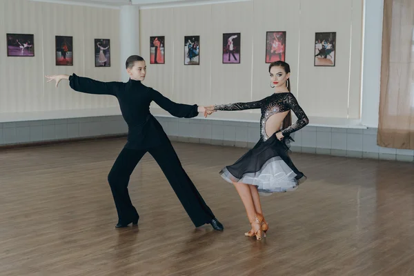 Professional dancers dancing in ballroom. Latin.