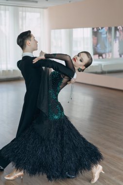 Professional dancers dancing in ballroom clipart