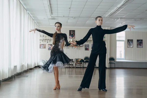 Professional dancers dancing in ballroom. Latin.