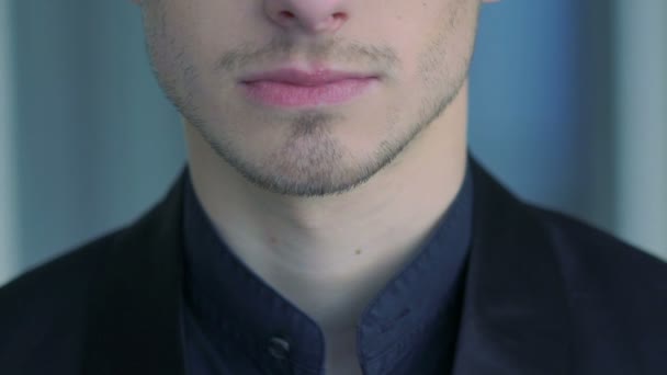 Close up of mans face, neck, lips and shirt. Slow motion — Stock Video