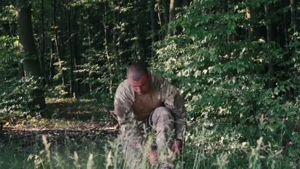 Military shoes in the forest — Stock Video