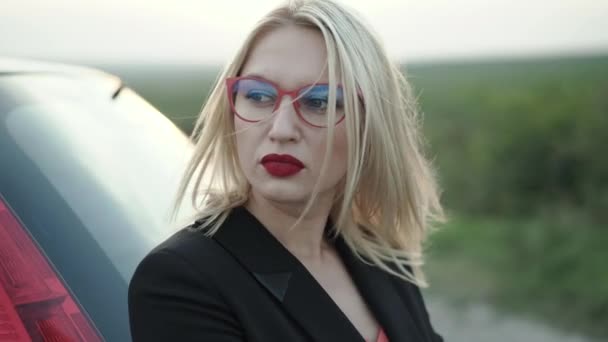 Portrait of worried lady looks aside at broken auto at suburban road — Stock Video