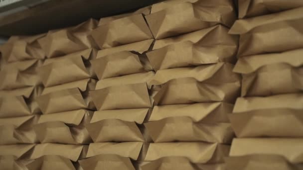 Background of packed coffee on the shelves — Stock Video