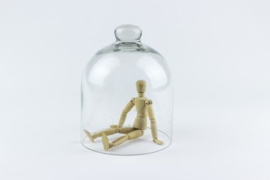 Wooden puppet in a glass bell clipart