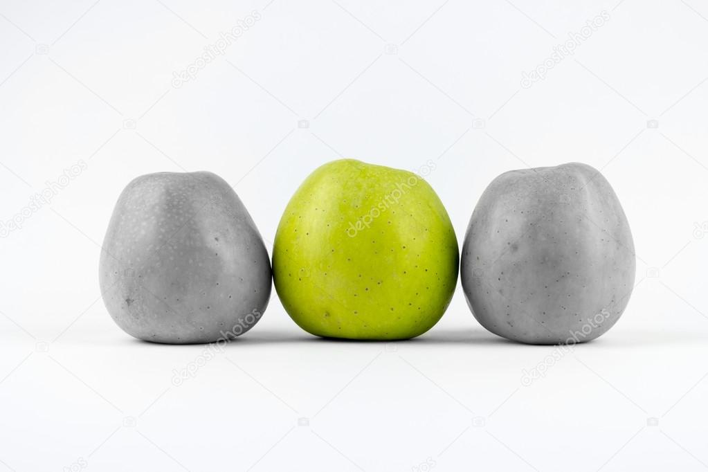 Three green apples on a white background