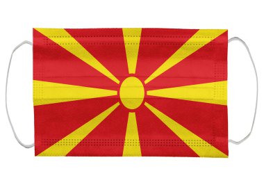 Tıbbi bir maske takan Macedonia bayrağı. Beyaz bir arka planda izole edilmiş. Corona virüsü ya da covid-19 için koruyucu solunum maskeleri virüs enfeksiyonu için, sağlık koruma konsepti, ağız kapağı, 3 boyutlu görüntüleme