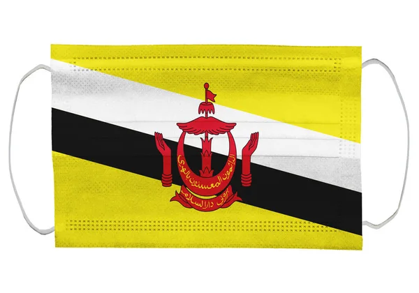 Brunei Flagge Auf Einer Medizinischen Maske Vereinzelt Auf Weißem Hintergrund — Stockfoto