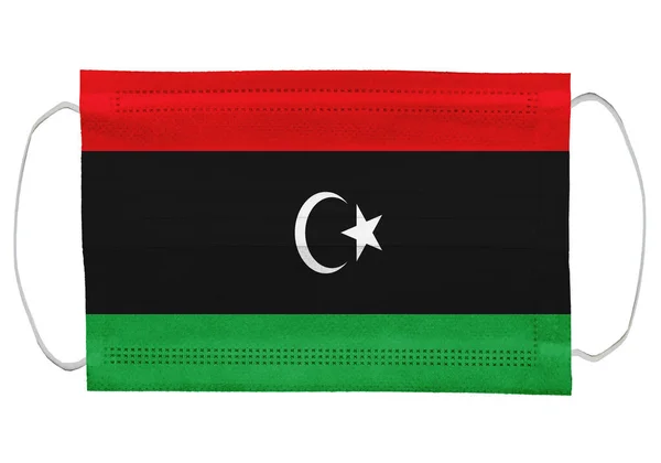 Libië Vlag Een Medisch Masker Geïsoleerd Witte Achtergrond Voor Corona — Stockfoto