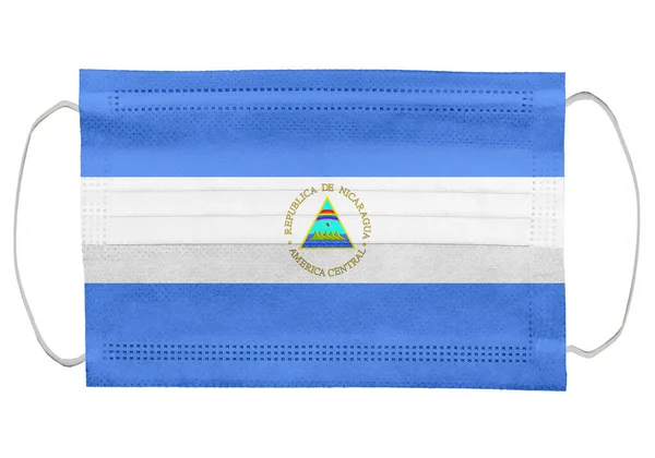 Nicaragua Vlag Een Medisch Masker Geïsoleerd Witte Achtergrond Voor Corona — Stockfoto