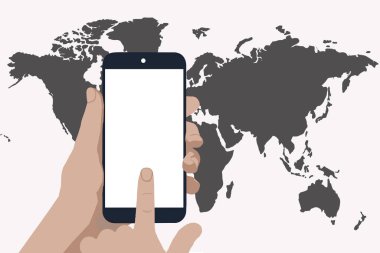 Elinde bir cep telefonu ve beyaz bir arka planda bir dünya haritası var. Temassız ödeme kavramı