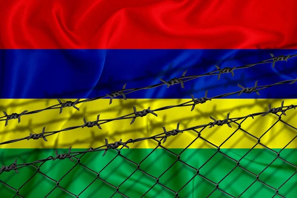 Mauritius flag development, fence mesh and barbed wire. Emigrants isolation concept. With place for your text.