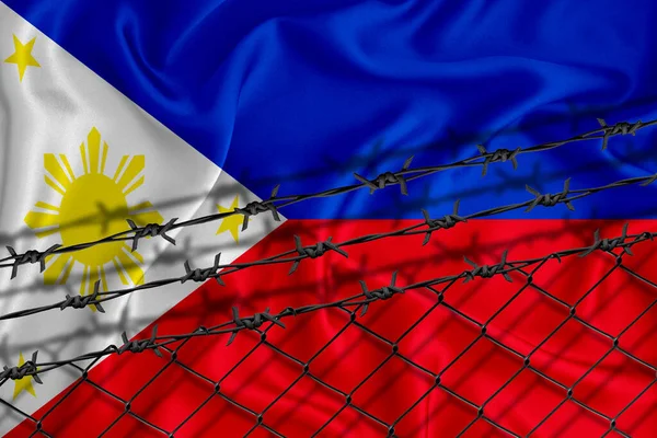 フィリピンの旗の開発 フェンスメッシュと鉄条網 移民隔離の概念 テキストの代わりに — ストック写真