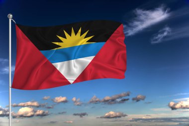 Antigua ve Barbuda ulusal bayrağı derin mavi gökyüzüne karşı rüzgarda dalgalanıyor. Uluslararası ilişkiler kavramı.