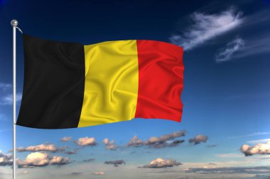 Belçika ulusal bayrağı derin mavi gökyüzüne karşı rüzgarda dalgalanıyor. Uluslararası ilişkiler kavramı.