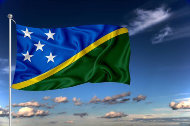 Solomon Adaları ulusal bayrağı derin mavi gökyüzüne karşı rüzgarda dalgalanıyor. Uluslararası ilişkiler kavramı.