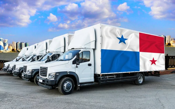 Panama flag on the back of Five new white trucks against the backdrop of the river and the city. Truck, transport, freight transport. Freight and Logistics Concept