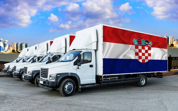 Croatia flag on the back of Five new white trucks against the backdrop of the river and the city. Truck, transport, freight transport. Freight and Logistics Concept
