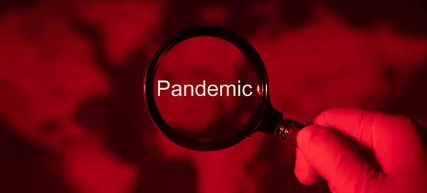 Magnifying Glass Toned Red Map World Pandemic Concept — Stock Photo, Image