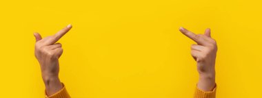 The double fuck you hand sign, female hands showing middle fingers gesturing