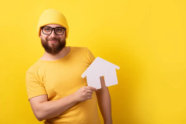 Man Holding Home Yellow Background Mortgage Loan Concept — Stockfoto