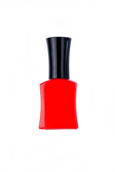 Red nail polish bottle on white background — Stock Photo, Image