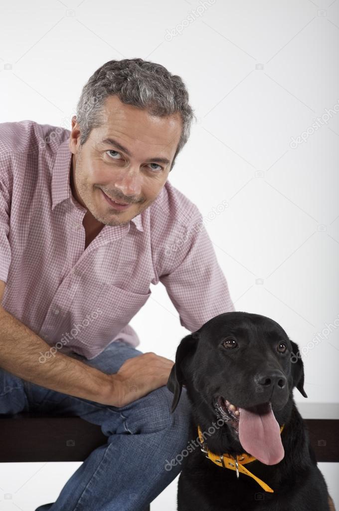 man playing with Labrador dog