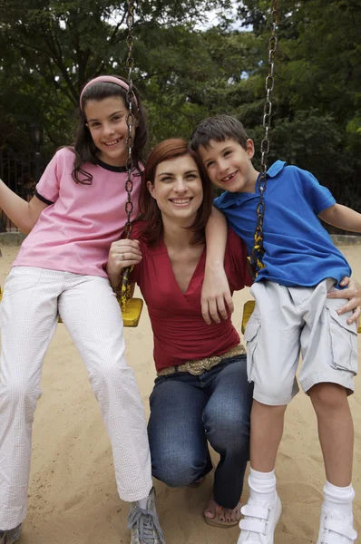 Mother and children on playground — Stock Photo, Image