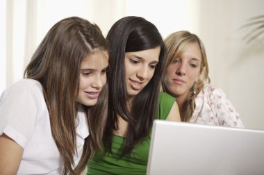 Teenage students with laptop clipart