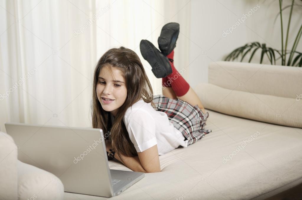 Teenager studying with laptop 