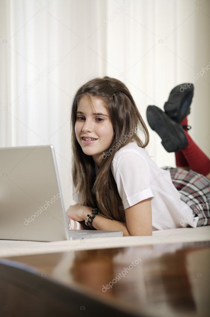 Teenager studying with laptop 