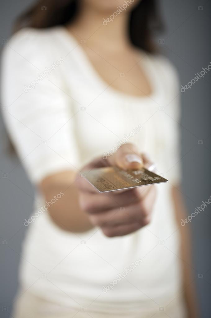 Woman showing credit card