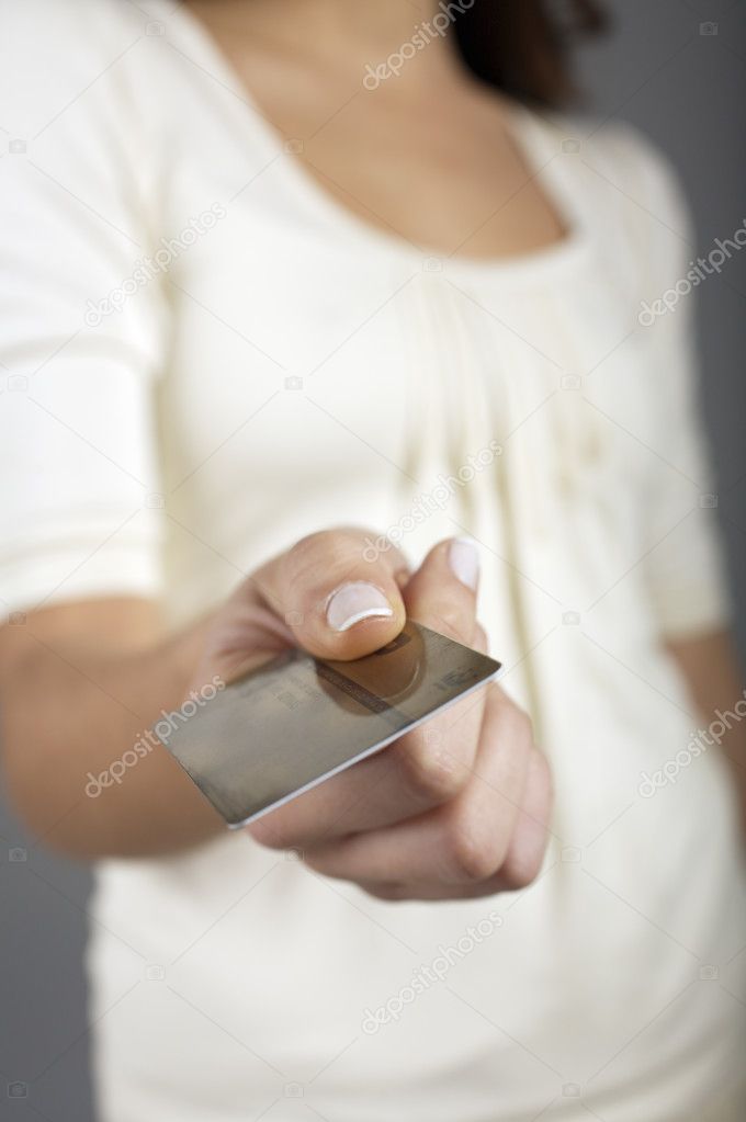 Woman showing credit card