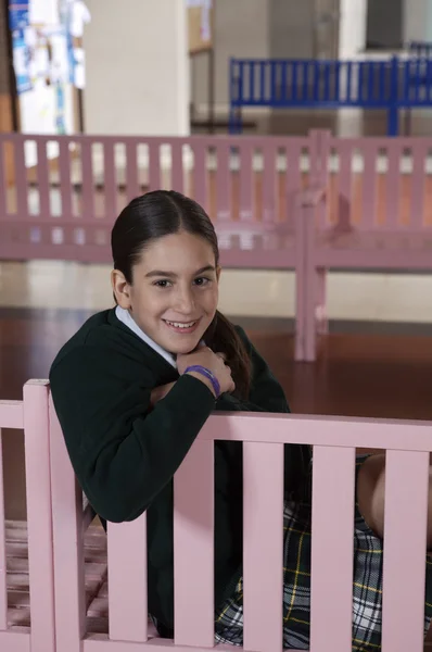 girl sitting on bench