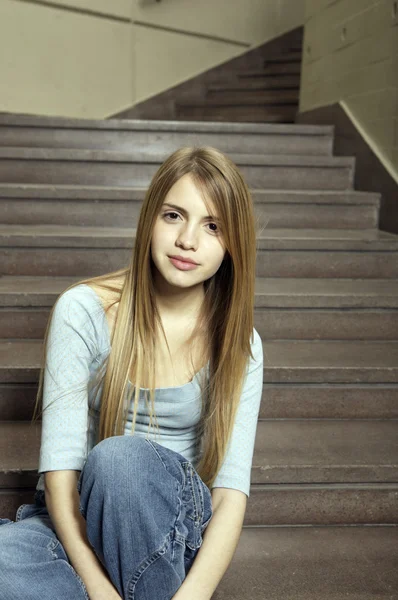 Student sitting on staircase — Stock Photo, Image