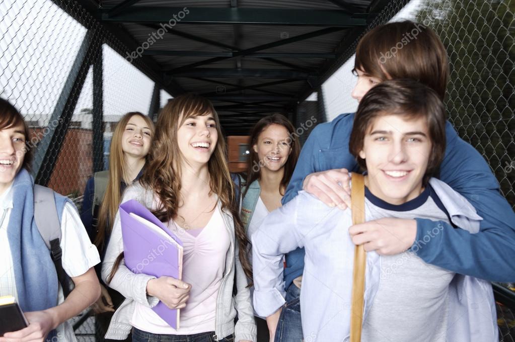 Teenage students walking together