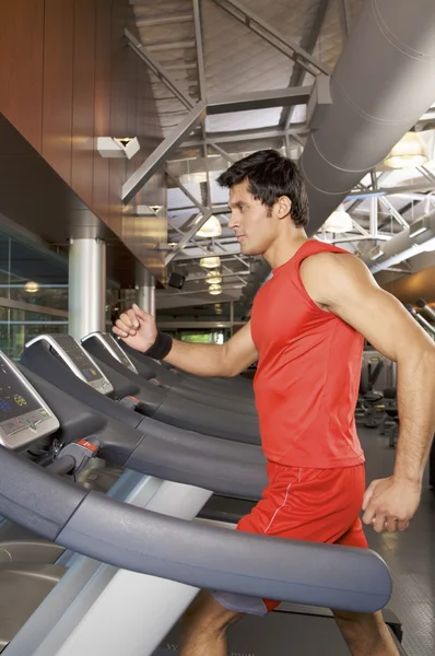 Man exercising on a treadmill — Stock Photo, Image