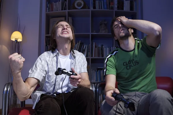 Two friends playing with joysticks — Stock Photo, Image