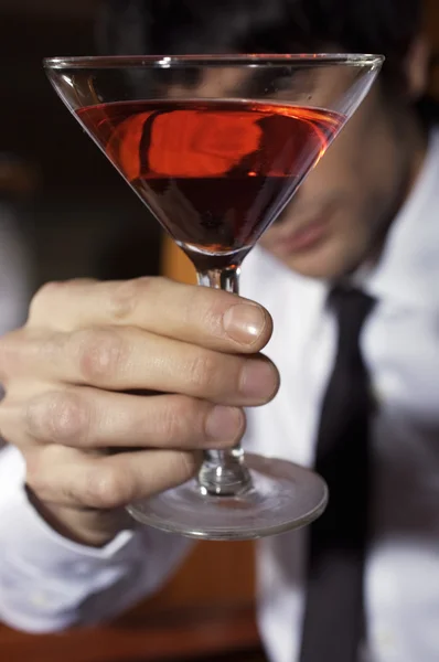 stock image young man holding alcohol drink 