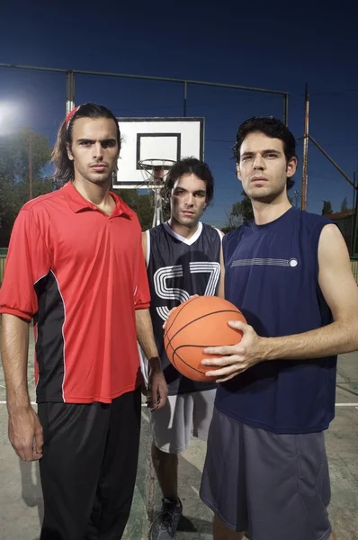 Three basketball players