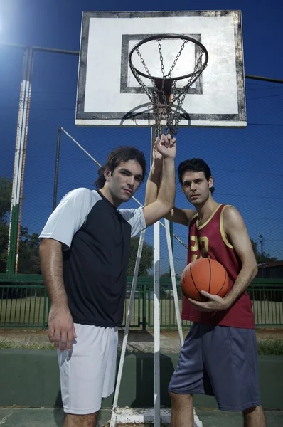 Young men standing on court — Stock Photo, Image