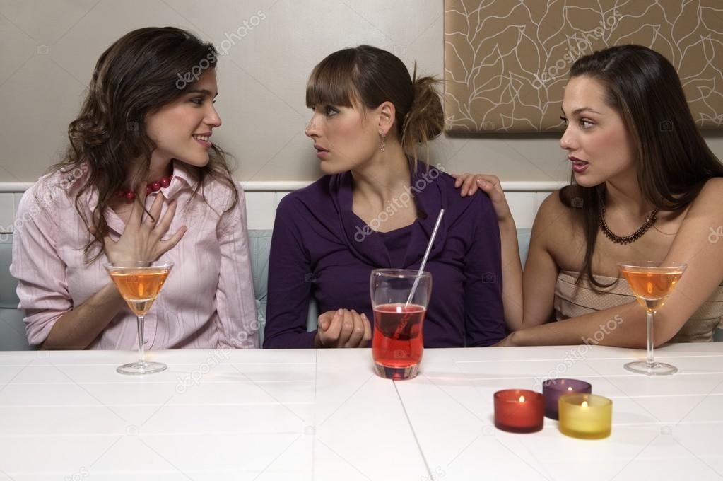 young women talking in restaurant