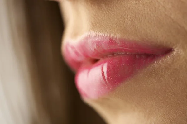 Female mouth with pink lipgloss — Stock Photo, Image