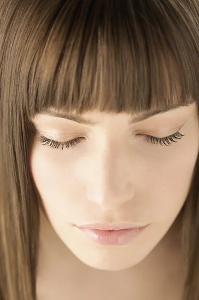 woman with straight hair and bangs