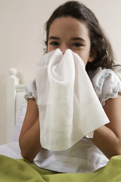 Little girl blowing her nose — Stock Photo, Image